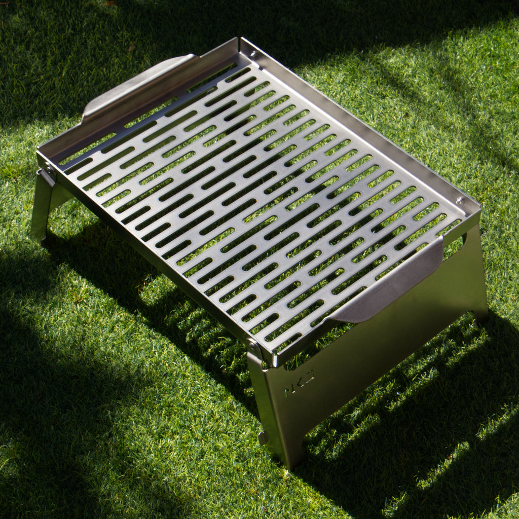 Stainless steel braai grid on grass