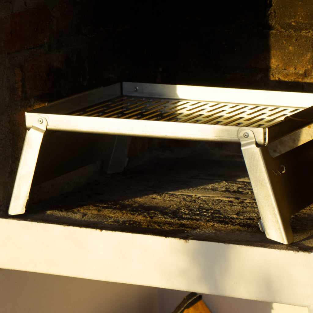 Stainless braai grid inside a indoor braai area