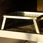 Stainless braai grid inside a indoor braai area