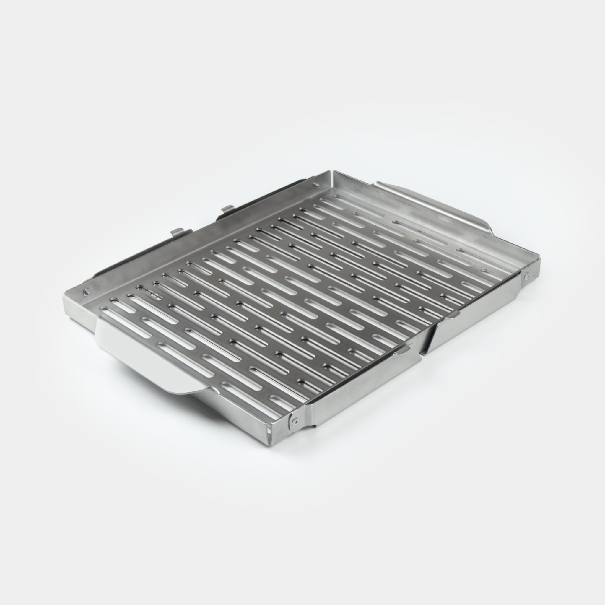 Stainless steel braai grid on a white background