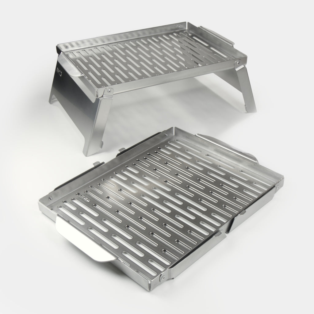 Two stainless steel braai grids on a white background
